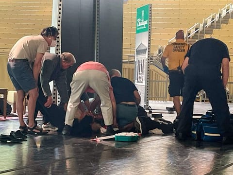 Author Salman Rushdie is tended to after he was attacked during a lecture, on August 12, 2022, at the Chautauqua Institution in Chautauqua, New York. 