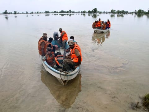 Pakistan soldiers evacuate villagers from flooded area, in Rajanpur, a district in the central Pakistan.