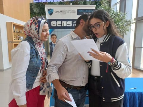 Rowan Ramadan from a GEMS school reacts after reading her results