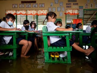 Photos: Students study in flooded Philippines' classroom