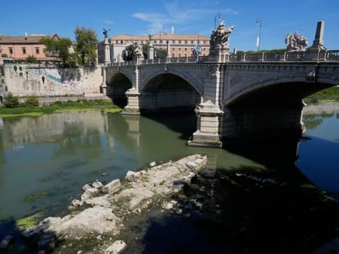 The ruins of the ancient Roman Neronian bridge, emerge from the river bed of the Tiber river, in Rome, on August 22, 2022.  