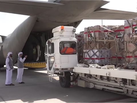 Still from WAM video showing loading of relief supplies on aircraft bound for Pakistan from UAE 