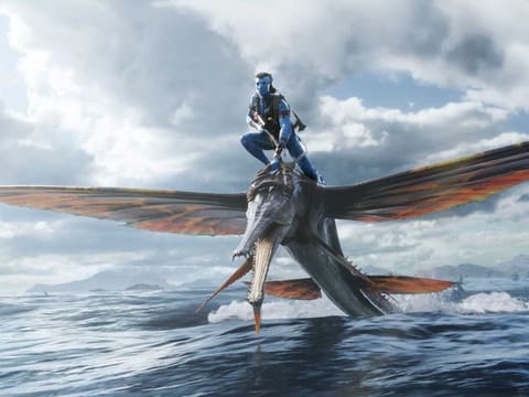 This image released by 20th Century Studios shows Jake Sully, voiced by Sam Worthington, in a scene from "Avatar: The Way of Water." 