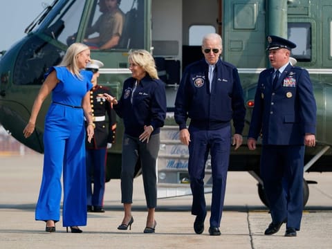 President Joe Biden and first lady Jill Biden are escorted by Col. Matthew Jones, Commander of the 89th Airlift Wing and his wife Christie Jones as they walk to board Air Force One at Andrews Air Force Base, Maryland on September 17, 2022, as they head to London to attend the funeral for Queen Elizabeth II. 