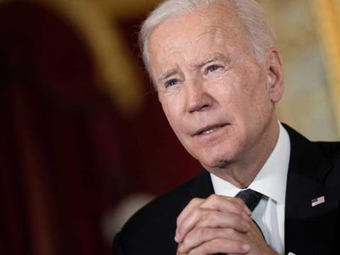 US President Joe Biden speaks after signing a book of condolence at Lancaster House in London on September 18, 2022, following the death of Queen Elizabeth II on September 8. 