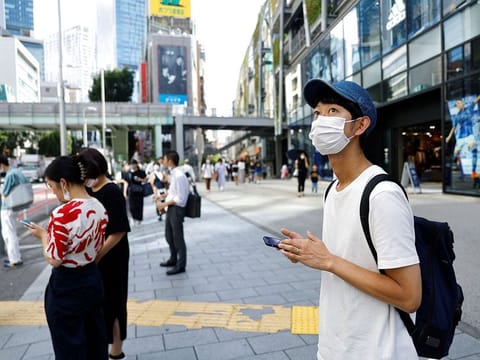 Shoji Morimoto who charges 10,000 yen ($71.30) per booking to accompany clients and simply exist as a companion, makes his way to meet his client in Tokyo, Japan August 31, 2022. REUTERS/Kim Kyung-Hoon