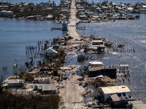 An aerial picture taken on September 30, 2022 shows the only access to the Matlacha neighbourhood destroyed in the aftermath of Hurricane Ian in Fort Myers, Florida.  