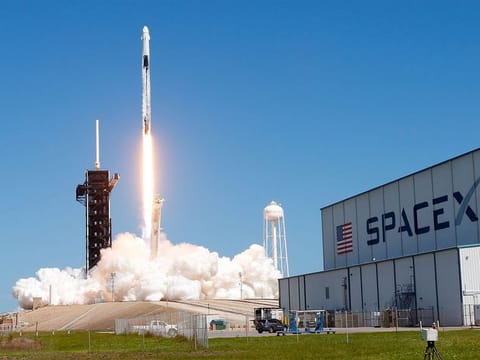 SpaceX is on track to book revenue of about $9 billion this year across its rocket launch and Starlink businesses. [Pictured: A SpaceX Falcon 9 rocket in Cape Canaveral, Florida, U.S.]