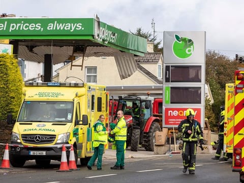 Emergency services attend the scene following an explosion in Creeslough, in the north west of Ireland on October 8, 2022. 