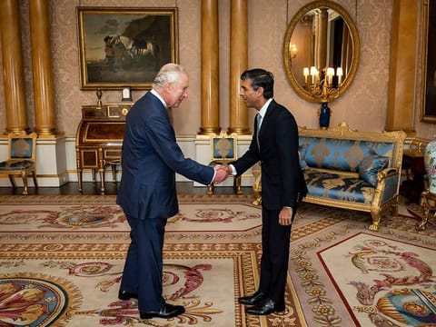 King Charles III welcomes Rishi Sunak during an audience at Buckingham Palace, London, where he invited the newly elected leader of the Conservative Party to become Prime Minister and form a new government, Tuesday, Oct. 25, 2022. 