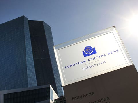 The logo and the headquarters building of the European Central Bank (ECB) are pictured ahead of a press conference on the eurozone monetary policy in Frankfurt am Main, western Germany, on October 27, 2022.
