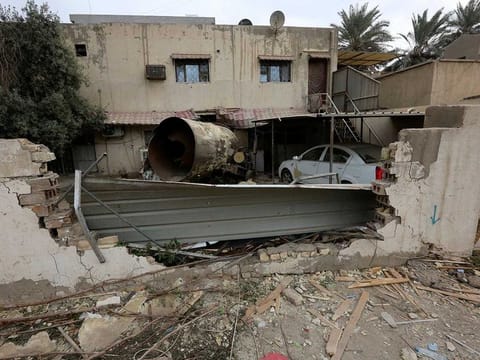 Debris lies scattered across the ground, the morning after a reported gas tanker explosion in the Iraqi capital Baghdad, that killed at least nine people and injured around 13 others, on October 30, 2022. 