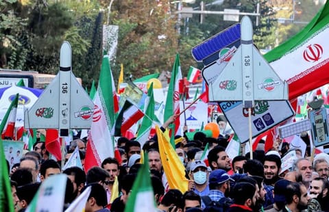 Iranians during a rally outside the former US embassy in the capital Tehran on November 4, 2022, to mark the 43th anniversary of the start of the Iran hostage crisis.  