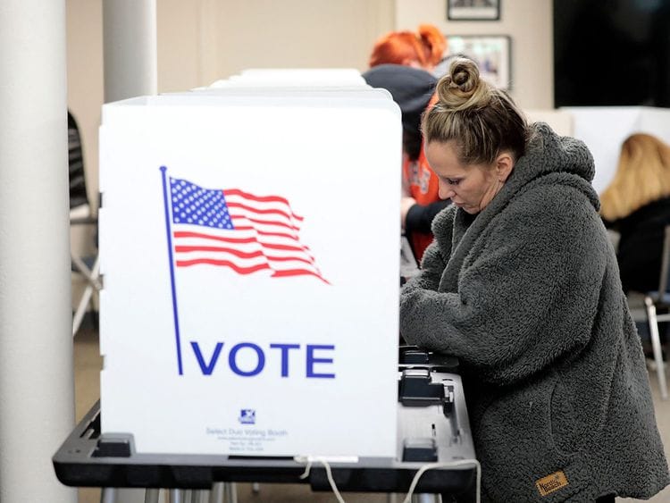 People cast their ballots in the US midterm election at Wolverine Lake, Michigan, on November 8, 2022.  