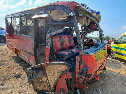Members of Egyptian security services look inside a damaged minibus that was pulled out of a water canal following a crash in al-Dayris village near the Nile Delta city of Mansoura in the Dakahlia Governorate, some 120Km north of the capital, on November 12, 2022. 