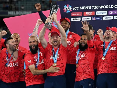 England's captain Jos Buttler (centre) holds the trophy as he celebrates with his players after victory over Pakistan in the ICC men's Twenty20 World Cup 2022 final cricket match at The Melbourne Cricket Ground (MCG) in Melbourne.