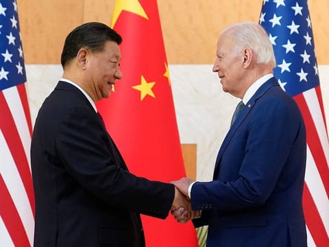 U.S. President Joe Biden, right, and Chinese President Xi Jinping shake hands before a meeting on the sidelines of the G20 summit meeting, Monday, Nov. 14, 2022, in Bali, Indonesia.