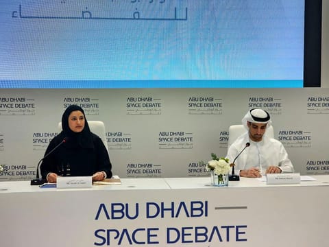 Sarah Al Amiri and Omran Sharaf addressing the media in Abu Dhabi.