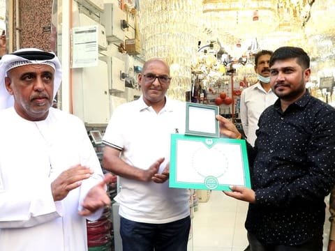 Indian expat Keshur Kara Chavada Karu Ghela being honoured by Dubai Police officials in Dubai.