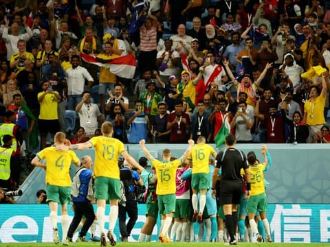 Australia celebrate at the end of their match against Denmark which they won 1-0 to reach the last 16 of the FIFA World Cup Qatar 2022.