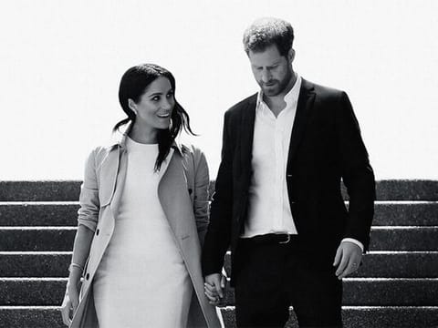 This image released by Netflix shows Prince Harry and Meghan, Duke and Duchess of Sussex, in a scene from the documentary "Harry & Meghan"