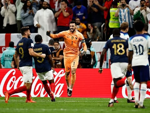 France's Hugo Lloris celebrates with teammates after England's Harry Kane fails to score a penalty