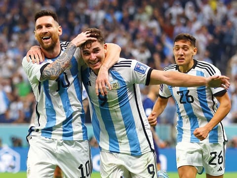 Argentina's Julian Alvarez celebrates scoring their second goal with Lionel Messi and Nahuel Molina.