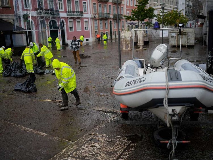 Municipal workers clean a street Portugal