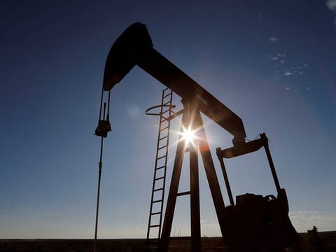The sun is seen behind a crude oil pump jack in the Permian Basin in Loving County, Texas, US. File photo taken on  November 22, 2019. 
