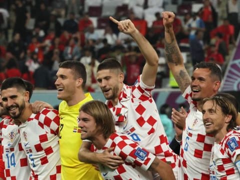 Croatia's players celebrate after winning the Qatar 2022 World Cup third place play-off against Morocco at Khalifa International Stadium in Doha.