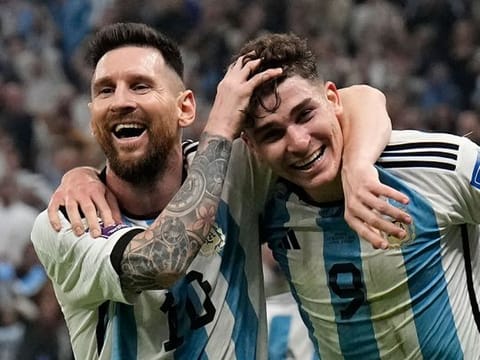 Argentina's Lionel Messi (left) and Julian Alvarez celebrate after scoring against Croatia in the FIFA World Cup Qatar 2022 football semifinal at the Lusail Stadium on December 13, 2022. Alvarez scored from a Messi assist. A repeat of that will be required for Argentina to beat France in the final on December 18, 2022. 