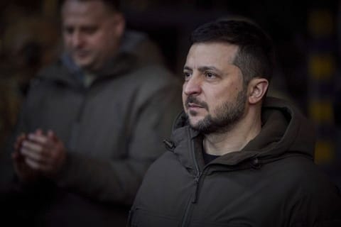 In this photo provided by the Ukrainian Presidential Press Office, Ukrainian President Volodymyr Zelenskyy, looks on as he meets soldiers at the site of the heaviest battles with the Russian invaders in Bakhmut, Ukraine, Tuesday, Dec. 20, 2022.