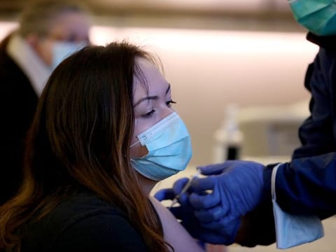 People receive free COVID-19 vaccinations and booster shots at Los Angeles International Airport in Los Angeles, California.