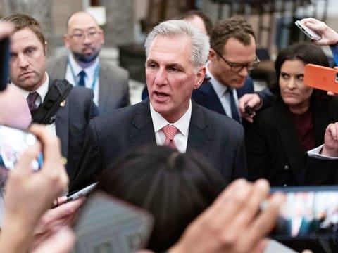 Republican Kevin McCarthy talks to reporters as he leaves the House floor after the House voted to adjourn for the evening as the House met for a third day to try and elect a speaker and convene the 118th Congress on Capitol Hill in Washington, on January 5, 2023. 