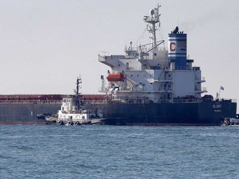 In this file photo the Marshall Islands-flagged bulk carrier M/V Glory leaves the Ukrainian port of Chornomorsk on August 7, 2022. - The Norwegian cargo vessel has run aground in the Suez Canal and authorities are attempting to refloat the ship, shipowner Leth said on January 9. "M/V Glory grounded while joining Southbound convoy near to al-Qantarah. Suez Canal Authority tugs are currently trying to refloat the vessel", the company wrote on Twitter. 