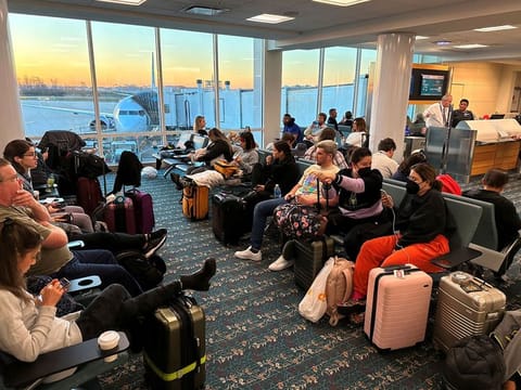 Stranded passengers wait at the Orlando International Airport.
