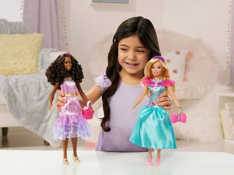 A child playing with Teresa, a My First Barbie deluxe set, new dolls made specifically for children as young as 3. 