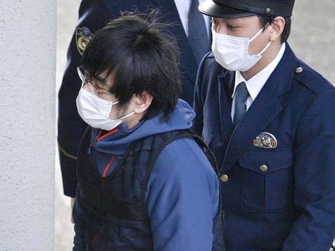 Tetsuya Yamagami, the alleged assassin of Japan's former Prime Minister Shinzo Abe, enters a police station in Nara, western Japan, on Jan. 10, 2023. 