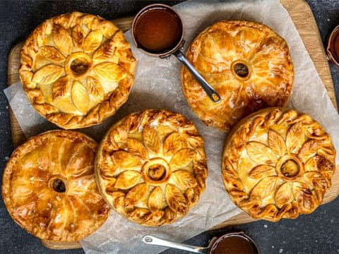 Hearty steak pie with mashed potatoes and red onion jam