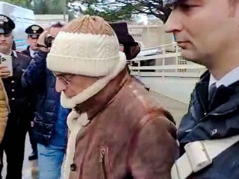 Top Mafia boss Matteo Messina Denaro, center, leaves an Italian Carabinieri barrack soon after his arrest.