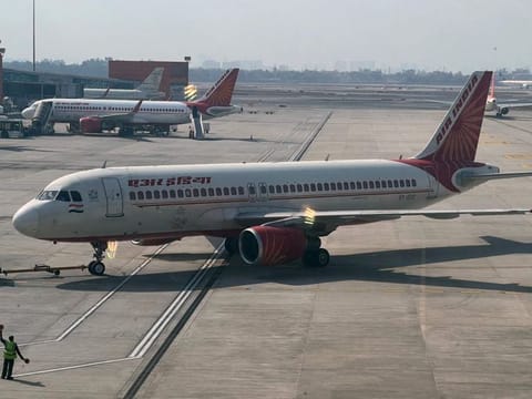 An Air India aircraft is pictured on the tarmac at the Indira Gandhi International airport in New Delhi on January 20, 2023. Currently, the matter lies with the Court and the case has witnessed many twists in the last couple of days. Shankar Mishra was arrested from Bengaluru and brought to Delhi where the case against him was registered. 