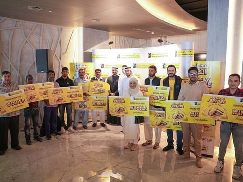 Winners of Redha Al Ansari Exchange's Wheels of Fortune promotion