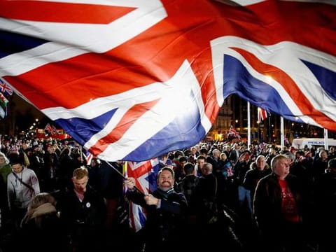 A man waves a British flag on Brexit day in London