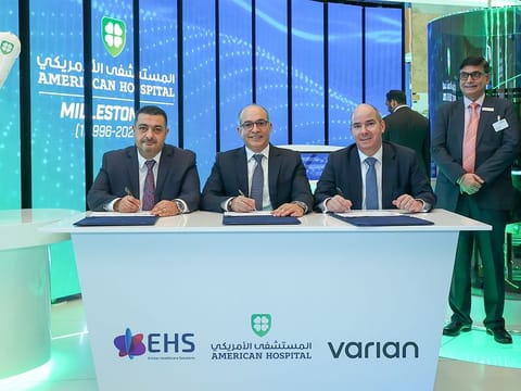 Sherif Beshara, CEO of American Hospital Dubai (centre);  Mohammed Kenanah (left), CEO of Emitac Healthcare Solutions; and Laurent Amiel, President, Radiation Oncology Solutions, Europe, Middle East and Africa at Varian, signed the agreement at Arab Health