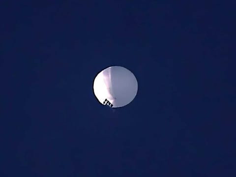 A high altitude balloon floats over Billings, Mont., on Wednesday, Feb. 1, 2023. The huge, high-altitude Chinese balloon sailed across the U.S. on Friday, drawing severe Pentagon accusations of spying and sending  excited or alarmed Americans outside with binoculars. 