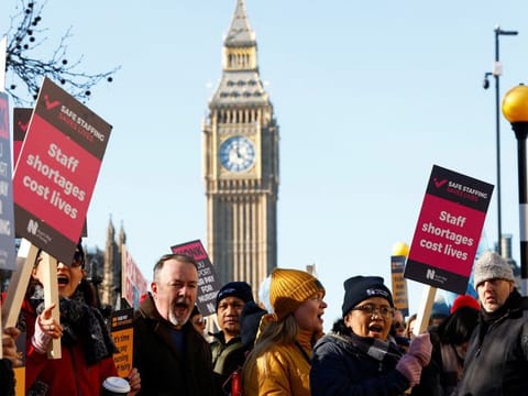 Nurses protest during a strike by NHS medical workers, amid a dispute with the government over pay, outside St Thomas' Hospital, in London, Britain, February 6, 2023.