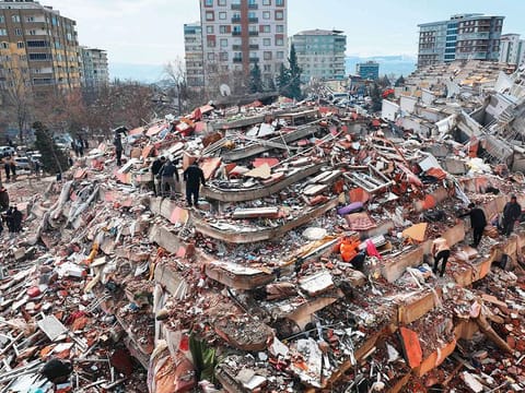 File image: Civilians look for survivors under the rubble of collapsed buildings in Kahramanmaras.
