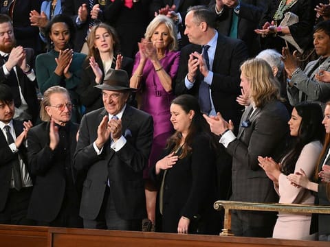 Attendees, including US First Lady Jill Biden, US Second Gentleman Doug Emhoff as US President Joe Biden delivers the State of the Union address in the House Chamber of the US Capitol in Washington, DC, on February 7, 2023. 