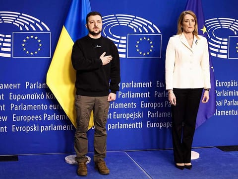 Ukraine's president Volodymyr Zelensky poses next to European Parliament President Roberta Metsola as he arrives for a summit at EU parliament in Brussels, on February 9, 2023.