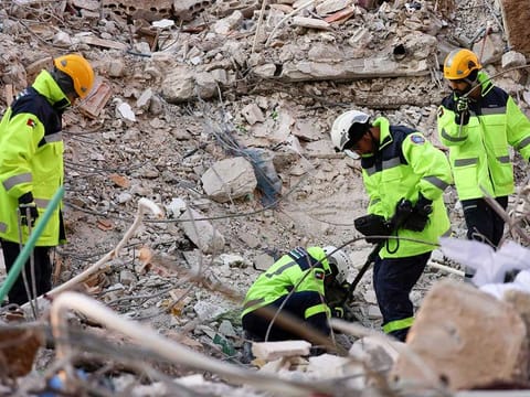 Emirati rescuers continue their search and rescue operations in the town of Jableh in the province of Latakia, northwest of the Syrian capital, on February 12 2023, in the aftermath of a deadly earthquake. 
